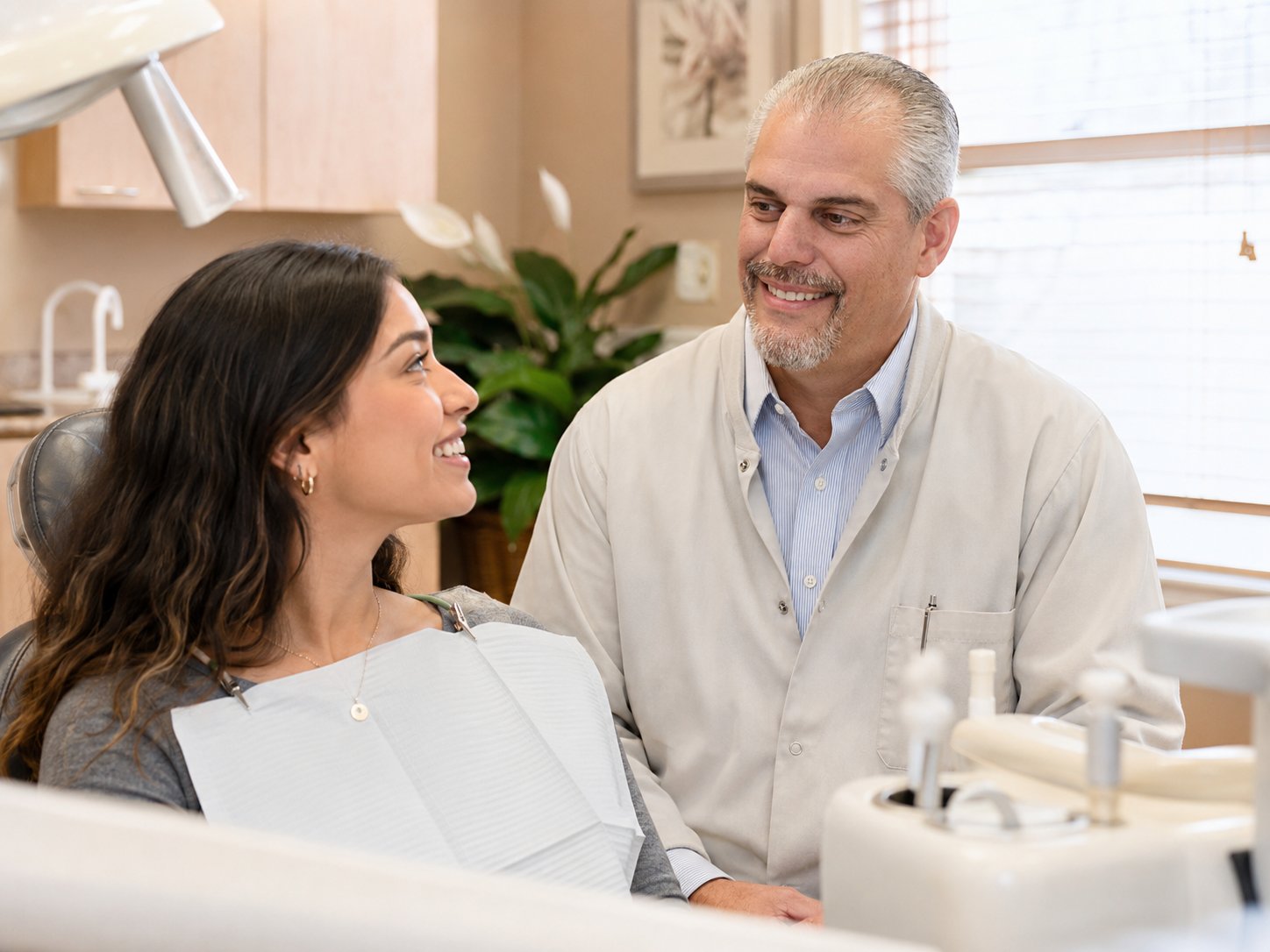 Dr. George Parlitsis speaking with a patient during a consultation at Carmel Dental Associates in Carmel NY